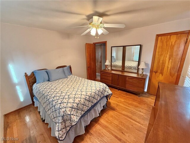 bedroom with light wood-style floors and ceiling fan