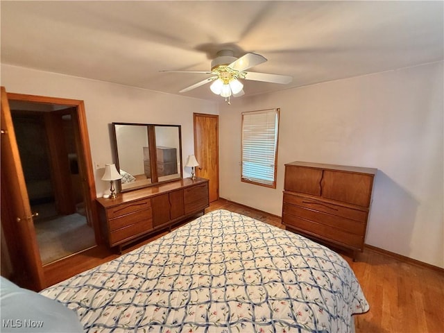 bedroom featuring wood finished floors and ceiling fan