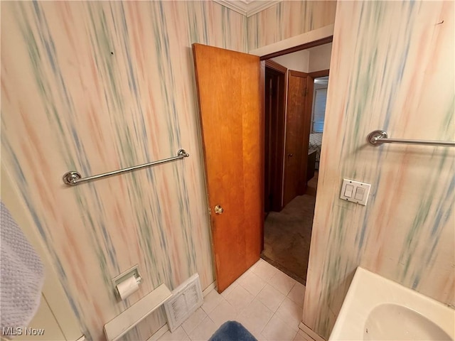bathroom with tile patterned floors and a sink