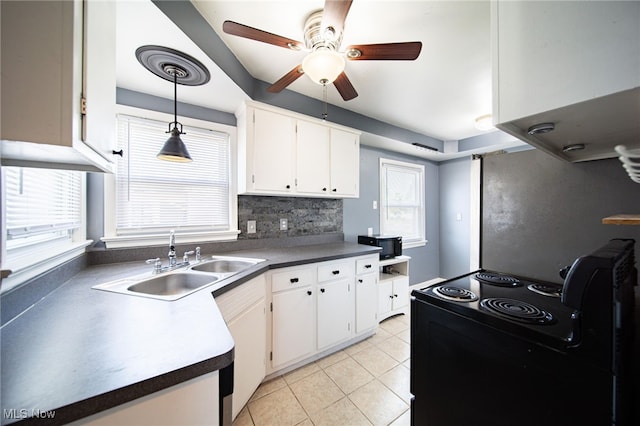 5132 Chestnut Hill Dr, Willoughby, OH 44094 - kitchen with black / electric stove, ceiling fan, white cabinetry, and light tile patterned floors
