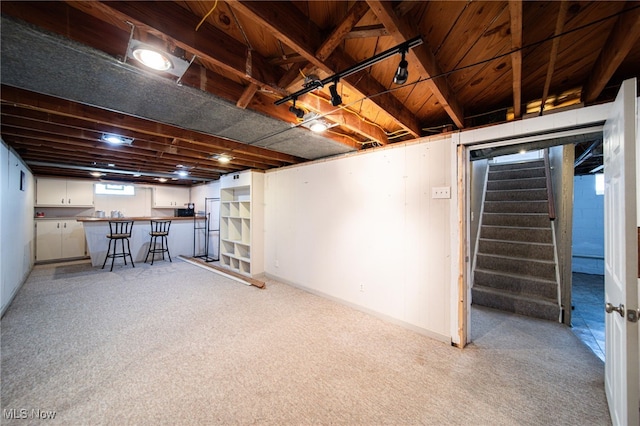 5132 Chestnut Hill Dr, Willoughby, OH 44094 - basement featuring light carpet, stairway, and bar
