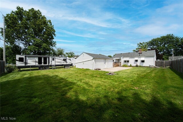 5132 Chestnut Hill Dr, Willoughby, OH 44094 - fenced backyard with an outdoor structure, a garage, and a patio area
