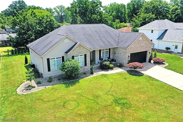 257 Country Club Dr SE, Warren, OH 44484 - single story home featuring an attached garage, concrete driveway, a front yard, and brick siding