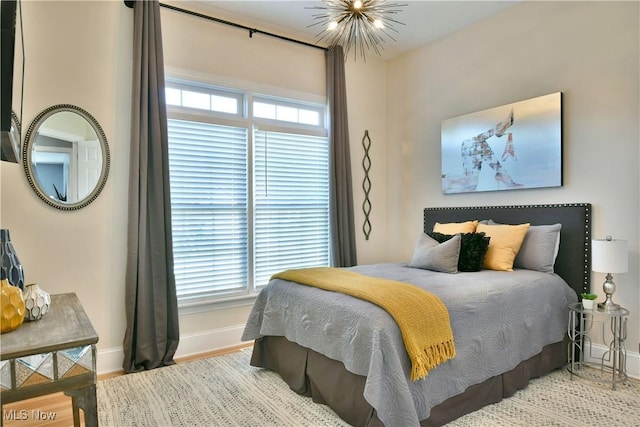 257 Country Club Dr SE, Warren, OH 44484 - bedroom with wood finished floors and a chandelier