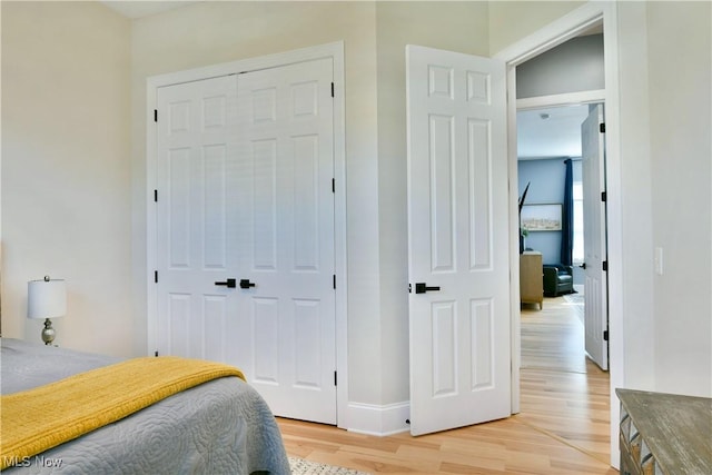 257 Country Club Dr SE, Warren, OH 44484 - bedroom featuring light wood-type flooring and a closet