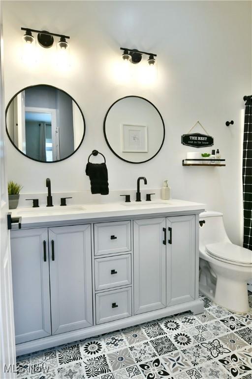257 Country Club Dr SE, Warren, OH 44484 - full bath featuring double vanity and tile patterned flooring