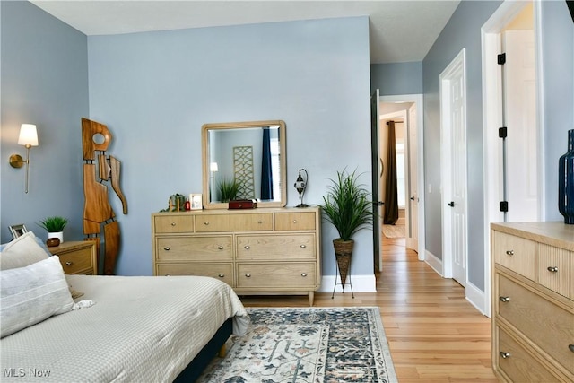 257 Country Club Dr SE, Warren, OH 44484 - bedroom with light wood-type flooring and baseboards