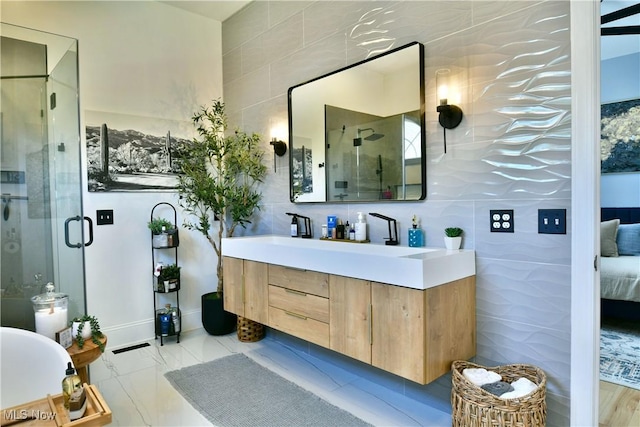 257 Country Club Dr SE, Warren, OH 44484 - ensuite bathroom featuring tile walls, vanity, and a stall shower