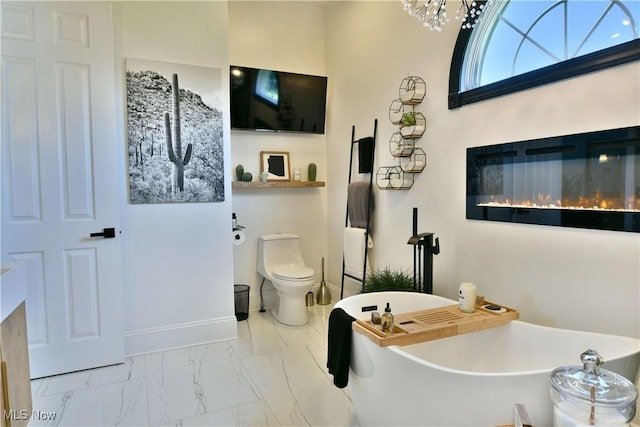257 Country Club Dr SE, Warren, OH 44484 - full bathroom featuring a freestanding tub, marble look tile flooring, and a chandelier