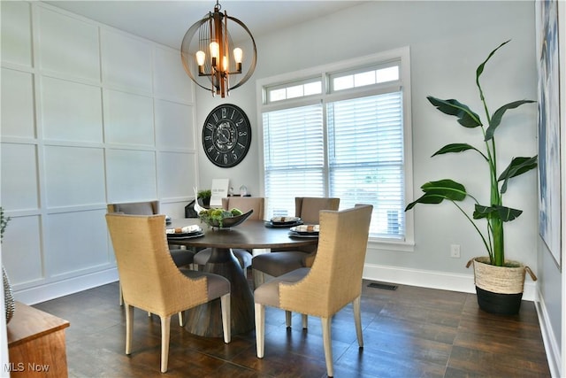 257 Country Club Dr SE, Warren, OH 44484 - dining room featuring a chandelier, healthy amount of natural light, and dark wood-style floors