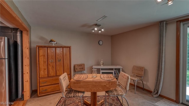11 Garfield Ave, New Concord, OH 43762 - dining space featuring light colored carpet and plenty of natural light
