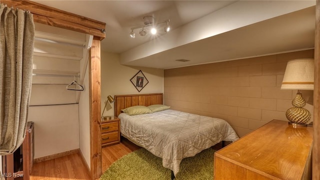 11 Garfield Ave, New Concord, OH 43762 - bedroom with wood finished floors and concrete block wall
