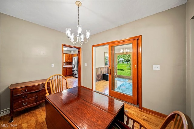 3988 Lake Rd, Conneaut, OH 44030 - dining area with a chandelier, wood finished floors, and an office area