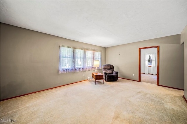3988 Lake Rd, Conneaut, OH 44030 - living area with healthy amount of natural light and carpet floors