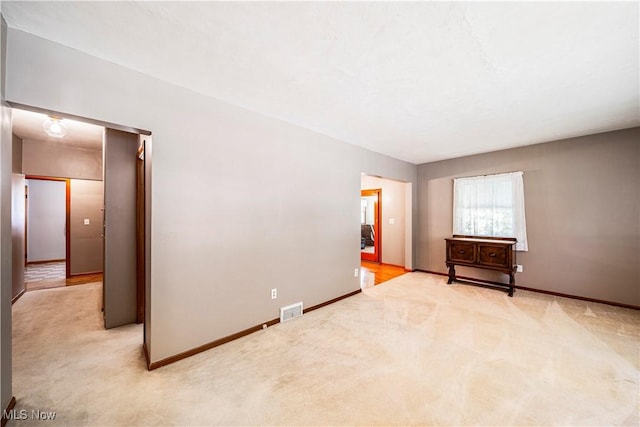 3988 Lake Rd, Conneaut, OH 44030 - spare room with light carpet and baseboards