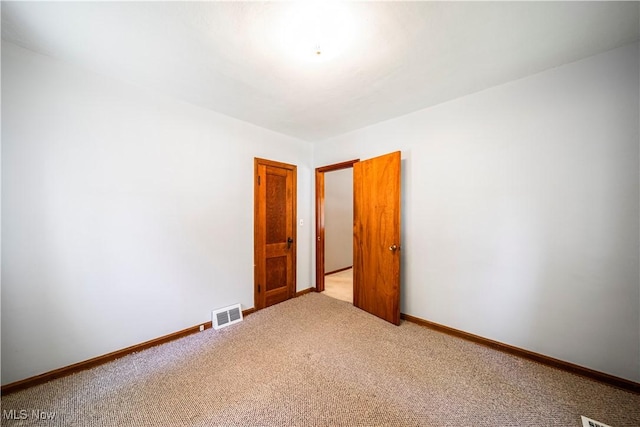 3988 Lake Rd, Conneaut, OH 44030 - carpeted spare room featuring baseboards