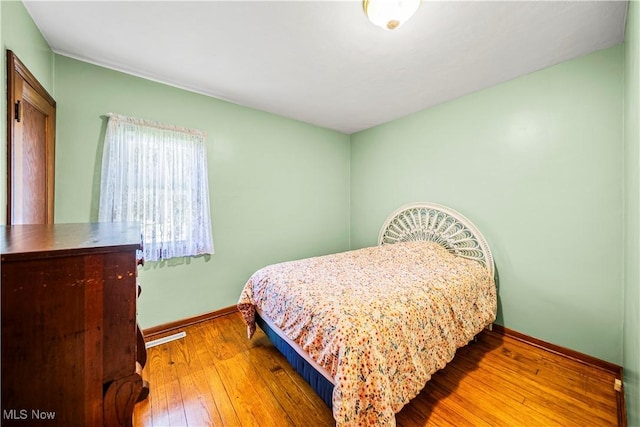 3988 Lake Rd, Conneaut, OH 44030 - bedroom with baseboards and hardwood / wood-style floors