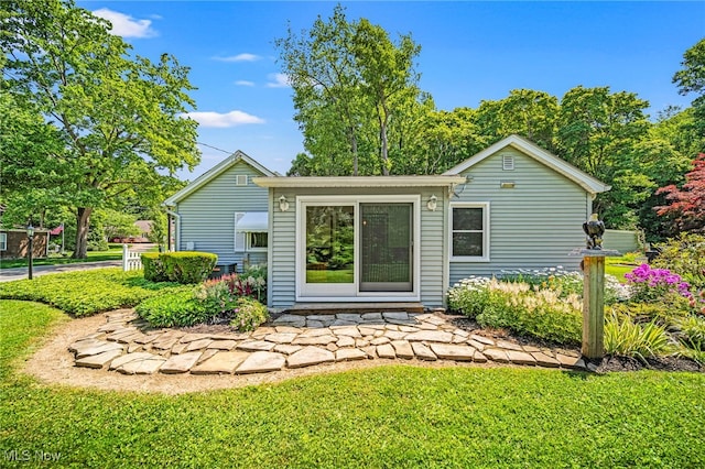 3988 Lake Rd, Conneaut, OH 44030 - rear view of house with a yard