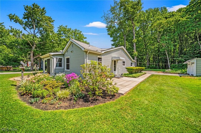 3988 Lake Rd, Conneaut, OH 44030 - view of side of property with a yard