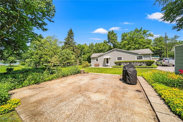 3988 Lake Rd, Conneaut, OH 44030 - view of grassy yard featuring a patio area