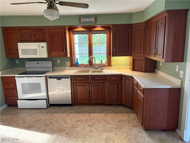 9513 Edison St NE, Alliance, OH 44601 - kitchen with white appliances, a ceiling fan, and light countertops