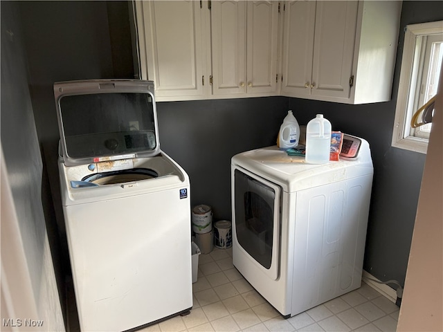 9513 Edison St NE, Alliance, OH 44601 - washroom with separate washer and dryer and light tile patterned floors