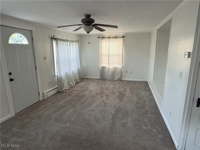 9513 Edison St NE, Alliance, OH 44601 - carpeted foyer with a baseboard heating unit, ceiling fan, ornamental molding, and a textured ceiling
