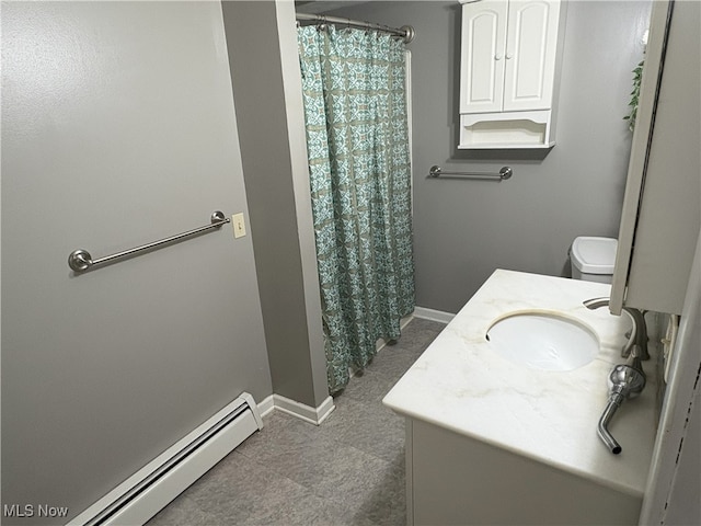 9513 Edison St NE, Alliance, OH 44601 - bathroom with a baseboard heating unit, vanity, and curtained shower
