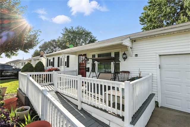 1932 Meister Rd, Lorain, OH 44053 - wooden deck with a garage