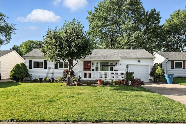 1932 Meister Rd, Lorain, OH 44053 - view of front of house with a garage, concrete driveway, a front yard, a porch, and a shingled roof
