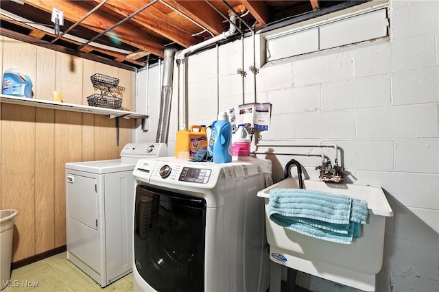 1932 Meister Rd, Lorain, OH 44053 - laundry room with separate washer and dryer and concrete block wall