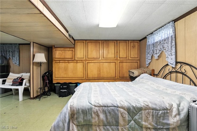 1932 Meister Rd, Lorain, OH 44053 - bedroom featuring tile patterned floors and wood walls