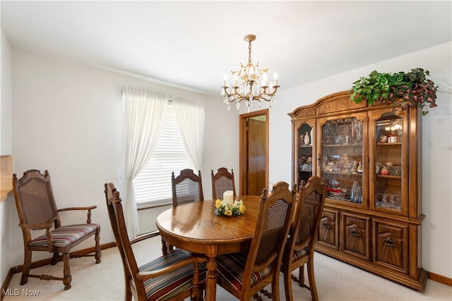 5222 Echovalley St NW, North Canton, OH 44720 - dining area featuring light carpet and a chandelier