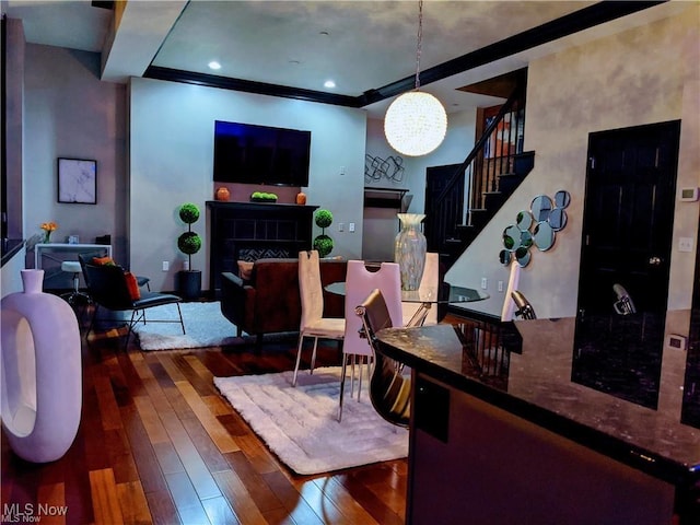 7482 Center St Unit 5, Mentor, OH 44060 - living area with wood-type flooring, stairway, a chandelier, and a fireplace