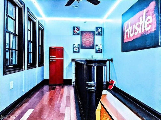 7482 Center St Unit 5, Mentor, OH 44060 - indoor wet bar with wood finished floors and a ceiling fan