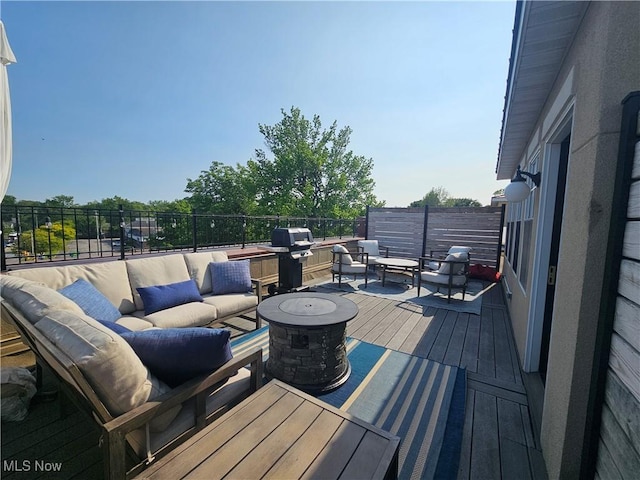 7482 Center St Unit 5, Mentor, OH 44060 - wooden deck featuring an outdoor living space with a fire pit and grilling area
