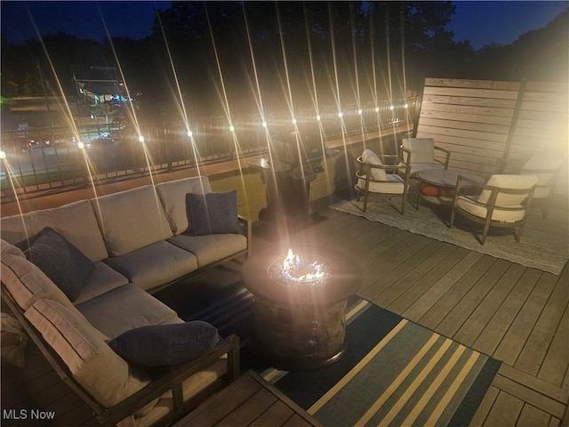 7482 Center St Unit 5, Mentor, OH 44060 - deck at twilight with an outdoor living space