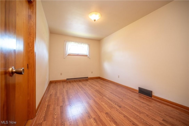 573 Grandview Ave, East Palestine, OH 44413 - spare room featuring light wood-style flooring and baseboard heating