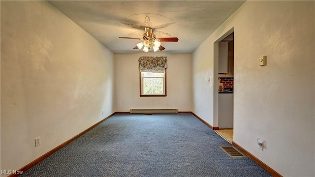 48846 Cain Ridge Rd, Clarington, OH 43915 - carpeted spare room with a baseboard heating unit and a ceiling fan