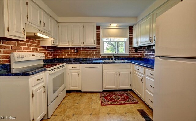 48846 Cain Ridge Rd, Clarington, OH 43915 - kitchen with white appliances, white cabinetry, dark countertops, decorative backsplash, and under cabinet range hood