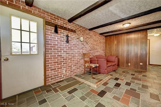 48846 Cain Ridge Rd, Clarington, OH 43915 - living area featuring a textured ceiling, wooden walls, and beamed ceiling