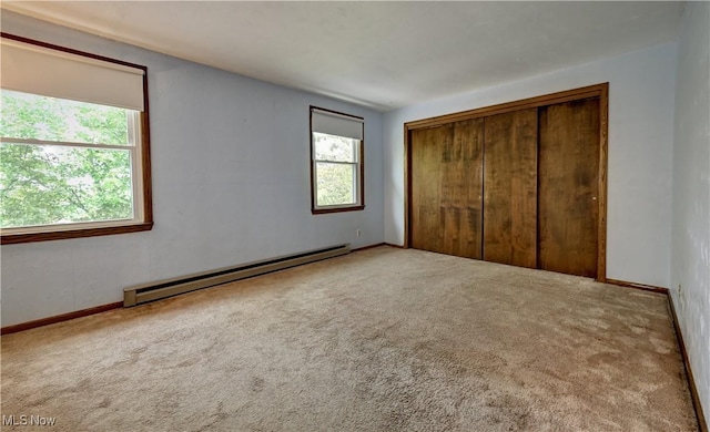48846 Cain Ridge Rd, Clarington, OH 43915 - unfurnished bedroom with baseboard heating, carpet flooring, and a closet
