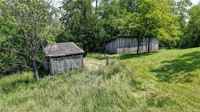 48846 Cain Ridge Rd, Clarington, OH 43915 - view of green lawn with a pole building and an outdoor structure