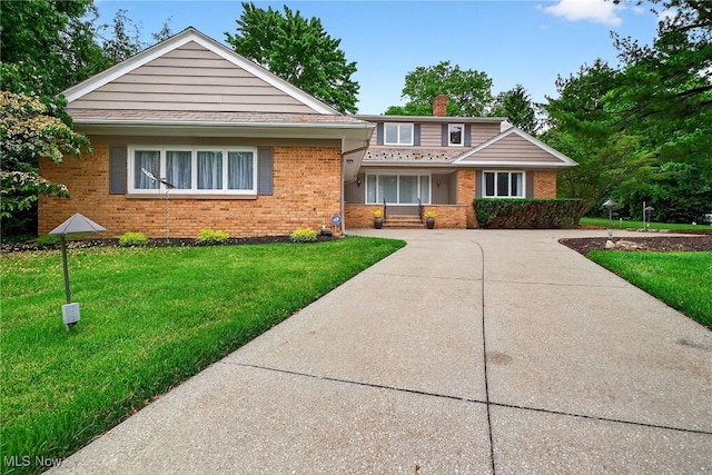 21349 Shelburne, Shaker Heights, OH 44122 - view of front of property with brick siding, a front lawn, and a chimney
