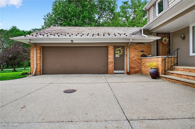 21349 Shelburne, Shaker Heights, OH 44122 - view of front of house featuring brick siding, a garage, and concrete driveway
