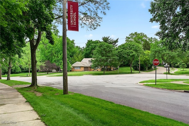21349 Shelburne, Shaker Heights, OH 44122 - view of asphalt road with traffic signs, sidewalks, and view of wooded area