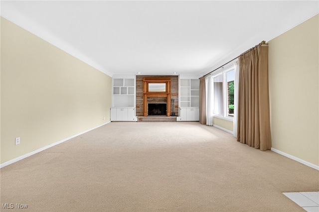 21349 Shelburne, Shaker Heights, OH 44122 - unfurnished living room featuring light carpet, a large fireplace, and built in shelves