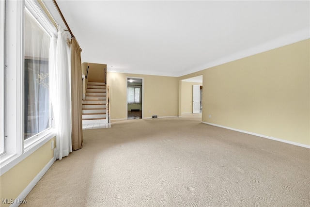 21349 Shelburne, Shaker Heights, OH 44122 - unfurnished living room featuring stairs and light colored carpet