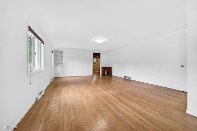 21349 Shelburne, Shaker Heights, OH 44122 - unfurnished room featuring baseboard heating and light wood finished floors