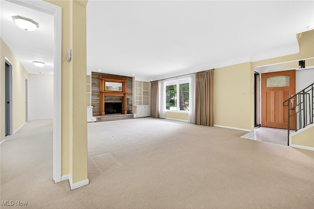 21349 Shelburne, Shaker Heights, OH 44122 - unfurnished living room featuring light colored carpet, stairs, a fireplace, and built in features